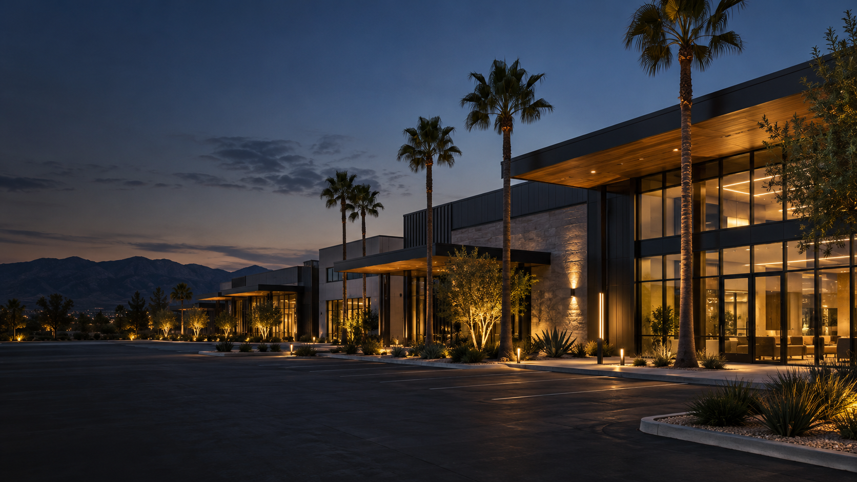 Illustrative Southern California commercial campus with warm exterior lighting at dusk